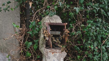 Devastated Outdoor Electric Box Pole With Exposed Cables Posing Shock Danger
