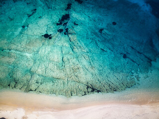 Aerial drone top view of sandy  beach and blue sea, Sardinia Italy