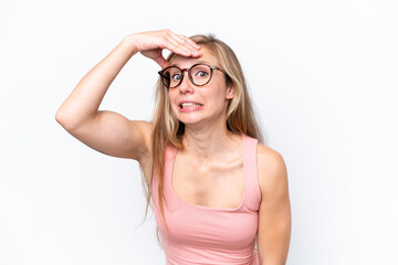 Young caucasian woman isolated on white background doing surprise gesture while looking front