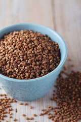 Buckwheat grain in a small ceramic bowl	