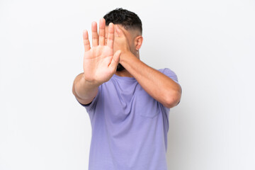 Young Arab handsome man isolated on white background making stop gesture and covering face