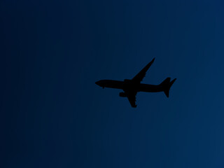 an airplane in the blue sky