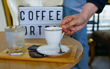 beverage; saucer; espresso; breakfast; object; hot; table; black; caffeine; white; cappuccino; brown; spoon; morning; closeup; break; aroma; bar; warm; coffe