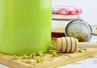 Fototapeta premium Preparations of natural infusion de chamomile and honey.