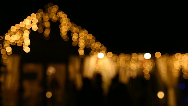 Lamps close up. Wedding garlands that glow near the restaurant window. Vespers Wedding Ceremony