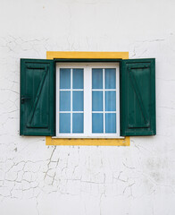 Typical vintage portuguese facade with green window