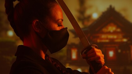 Young and beautiful ninja girl in a mask and with a katana. Samurai woman on the background of Japanese temple.