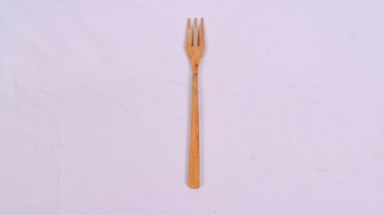 a fork made of wooden high quality isolated in white background