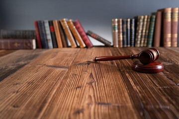 Law theme - judge office. Gavel and legal books on the judge desk. 