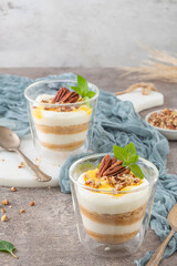 Natas do Ceu is a traditional Portuguese dessert made with cream, eggs and biscuits decorated with pecan nuts and mint leaves