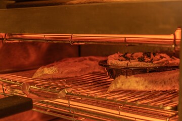 Closeup of roasted camembert in its salamander