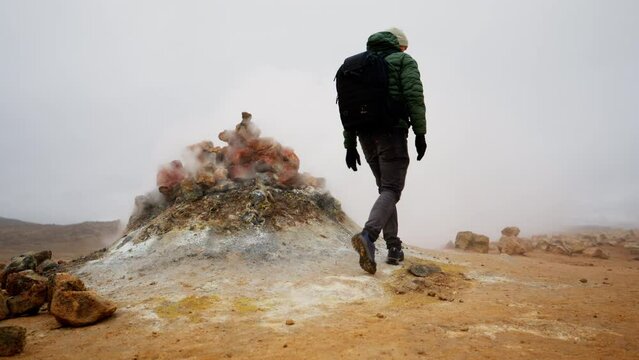Man Walking Near The Fumarole Of Myvatn