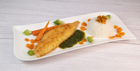 Recipe for Hake fillet breaded with panko, rice, carrot chips and coriander sauce. High quality...