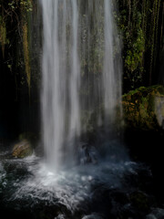 Fototapeta na wymiar a waterfall in the mountains
