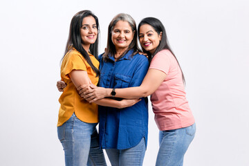 Three indian women giving expression together on white background.