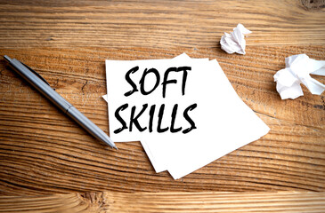 SOFT SKILLS text written on sticky on wooden background