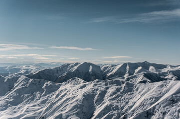 winter mountains at ski resort of caucasus Gudauri, sunny snowy day