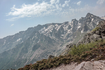 Fototapeta na wymiar Mountains with snow. Some beautiful views during the long distance hike GR20 in Corsica.