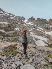 Woman hiking the long distance hike in Corsica called the GR20. A long hike with a heavy backpack....