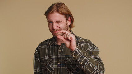 Need some more, please give me. Man showing a little bit gesture with sceptic smile, showing...