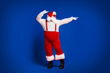 Full length body size view of his he attractive cool funny comic fat white-haired Santa mc artist dancing having fun festal day isolated bright vivid shine vibrant red burgundy maroon color background