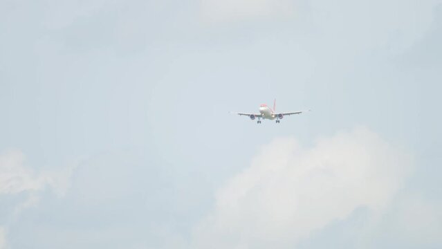 AMSTERDAM, THE NETHERLANDS - JULY 27, 2017: Front view of Airbus A320 EasyJet approaching before landing at Schiphol Airport, Amsterdam. Tourism and travel concept
