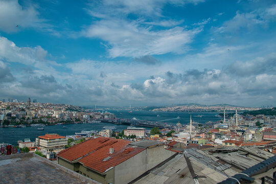 Istanbul, Turkey, June 7, 2015: Image of Istanbul with Galata Bridge, Galata Tower and Yeni Cami Mosque on a cloudy day.