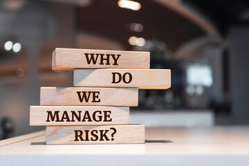 Wooden blocks with words 'Why do we manage risk?'.