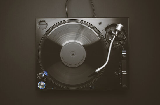 Flat lay image of dj turntable on black background. Overhead photo of professional disc jockey record player