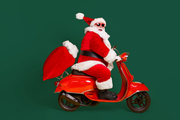 Full size profile side photo of grey white hair bearded santa claus ride drive scooter deliver...