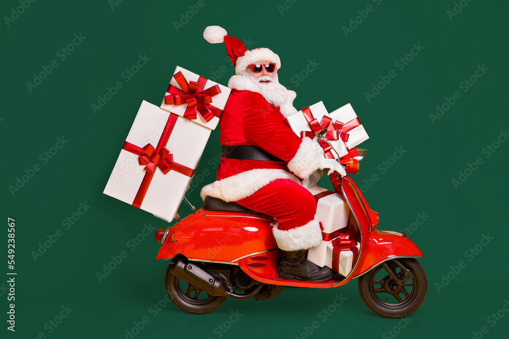 Wall mural full size profile side photo of white grey hair bearded santa claus ride motorbike deliver x-mas chr