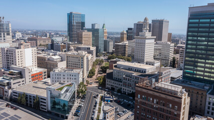 Afternoon skyline aerial view of the urban core of downtown Oakland, California, USA.