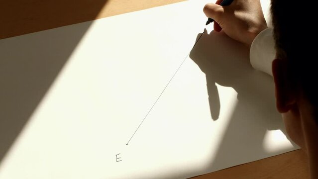 Young mathematician marks points on a segment line on the white paper. Pavel Kubarkov, my hand and diagonal line. Date of shooting day 8 October 2022 year, MSK time. This video was filmed in Russia.
