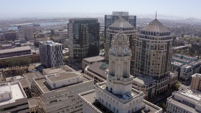 Afternoon skyline aerial view of the urban core of downtown Oakland, California, USA.
