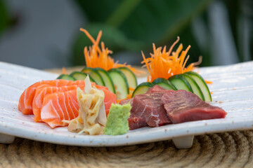 Sushi is a Japanese dish of prepared vinegared rice, usually with some sugar and salt, accompanied by a variety of ingredients.