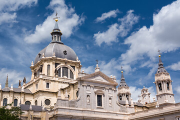Fototapeta na wymiar Bell tower and dome of the cathedral Santa Maria la Real de la Almudena in Madrid