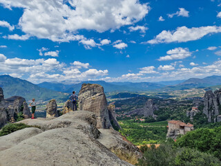 Fototapeta na wymiar People enjoy the spectacular view of the Meteora rock formations hosting Orthodox Christian monasteries in Greece