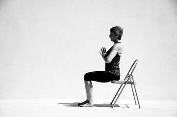 Mature adult woman practicing healing yoga.  - 549246140