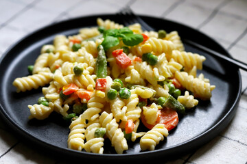 Pasta Salad with vegetables with sauce and spices.