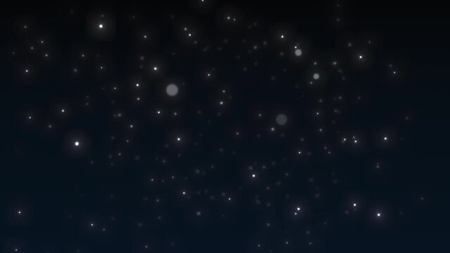 Sparkling slow-falling particles. Particles from bokeh on a dark blue background. Sparkling snow.
