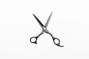 Professional black hairdressing scissors isolated on white background, hair tools, beauty, fashion