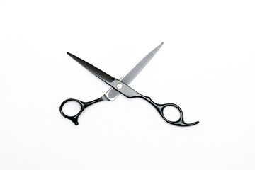 Professional black hairdressing scissors isolated on white background, hair tools, beauty, fashion