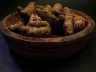 Turmeric on wooden plate