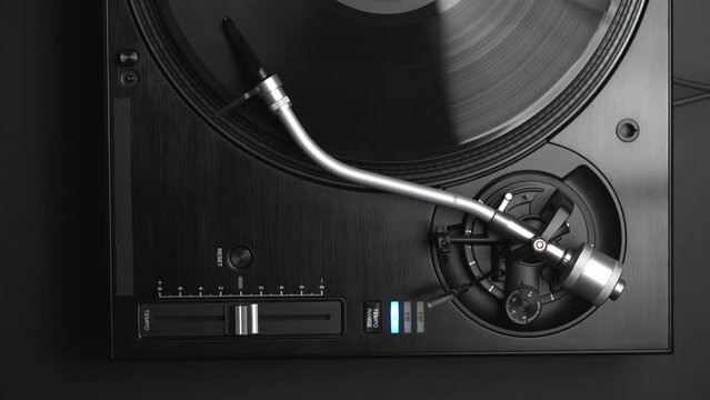 Dj turntable playing vinyl disc with music on vertical 4K video clip filmed directly from above. Disc jockey record player in flat lay footage