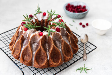 Christmas homebaked  bundt cake decorated with icing and cranberries