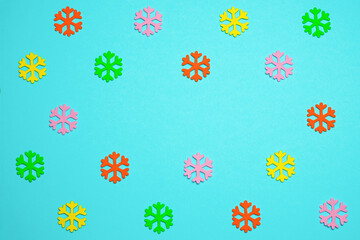 Snowflakes made of felt on a blue background. Christmas concept.