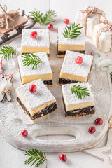 Fototapeta na wymiar Tasty Poppy seed cheesecake for Christmas as perfect festive dessert.