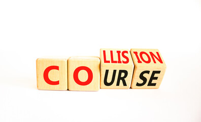Collision course symbol. Concept word Collision course on wooden cubes. Beautiful white table white background. Business collision course concept. Copy space.
