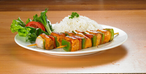 Spicy barbecued Chicken Tikka Boti on skewers