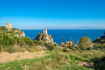 Fototapeta na wymiar The watch towers Torre della Tonnara at the north coast of Sicily are part of the Tonnara of Scopello, the famous and former tuna factory and fishing station of the village of Scopello